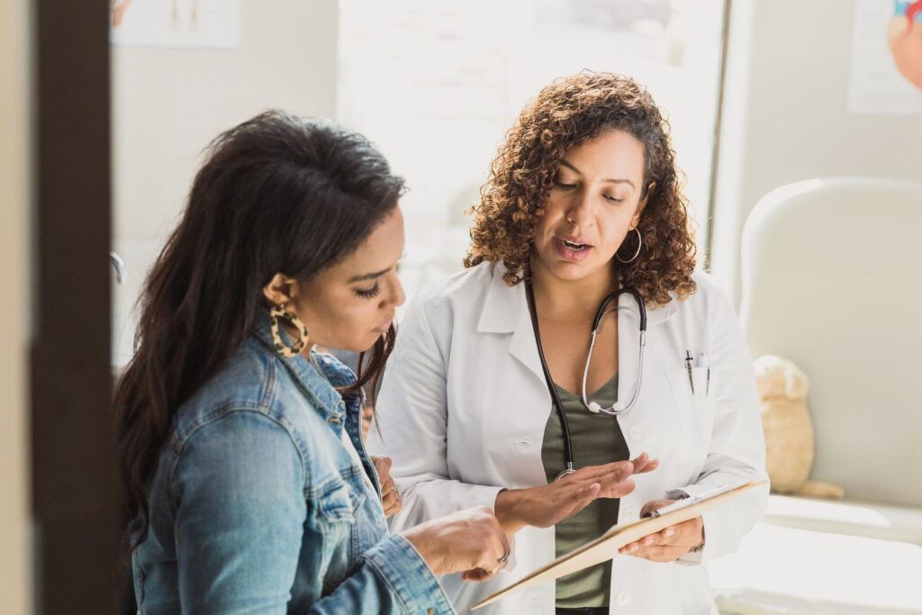 Doctor explaining something from a tablet