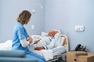 revenue cycle management - A paramedic talking with a patient