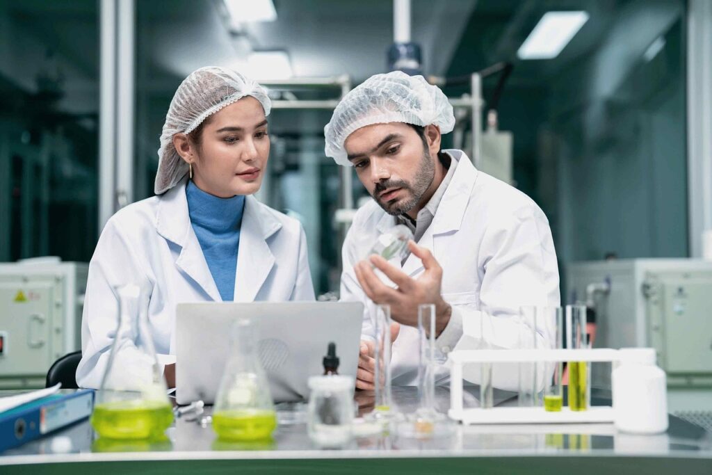 Lab staff looking at a tray