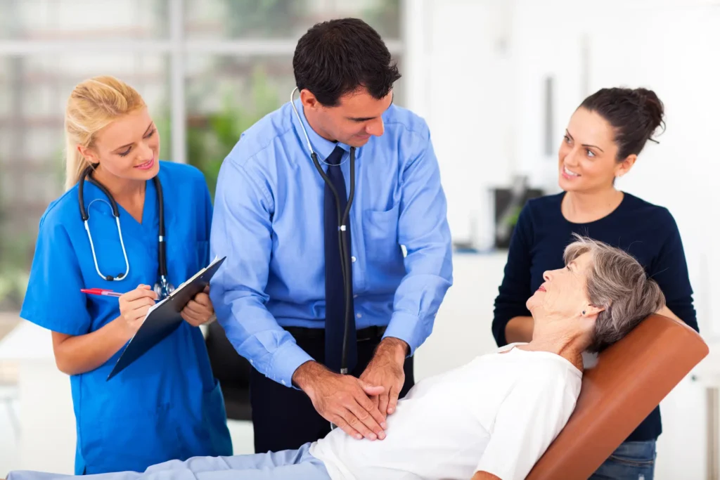 Hepatology Billing Services - Doctor Examining patient along with paramedics