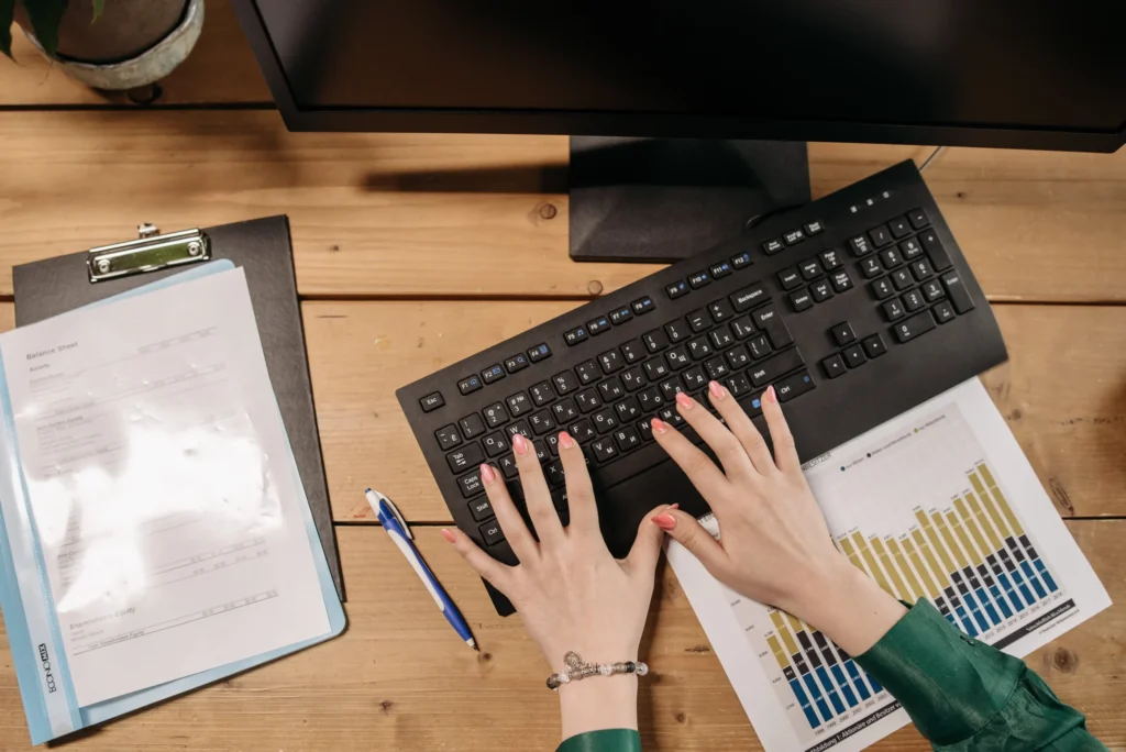 Someone typing on a keyboard