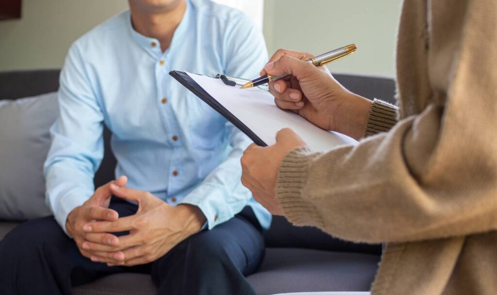 Psychology Billing Services USA-A person taking notes