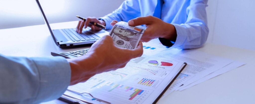 Someone giving money to other person