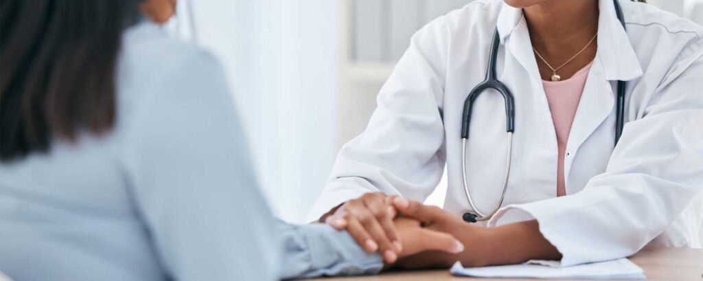 Doctor consoling a patient