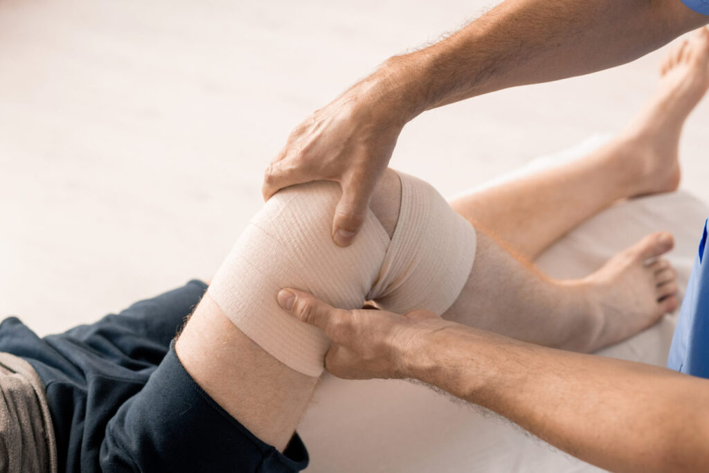 Wound Care Billing Services-Doctor tending to a wound